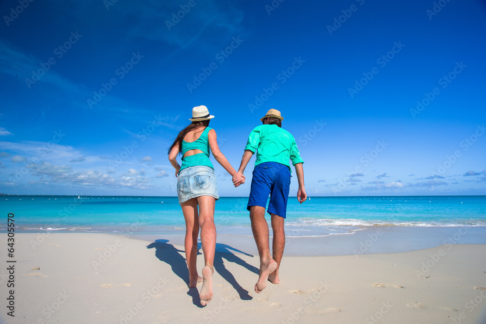 Young romantic couple have fun at Caribbean beach