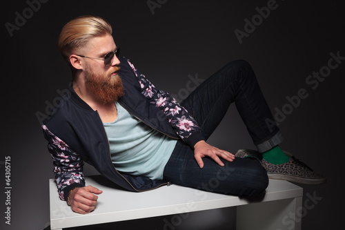 bearded man relaxes in studio © Viorel Sima
