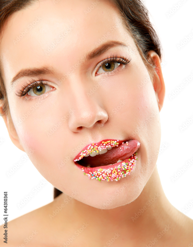 close up of woman lips with multicolored pearls close up of woman lips with multicolored pearls