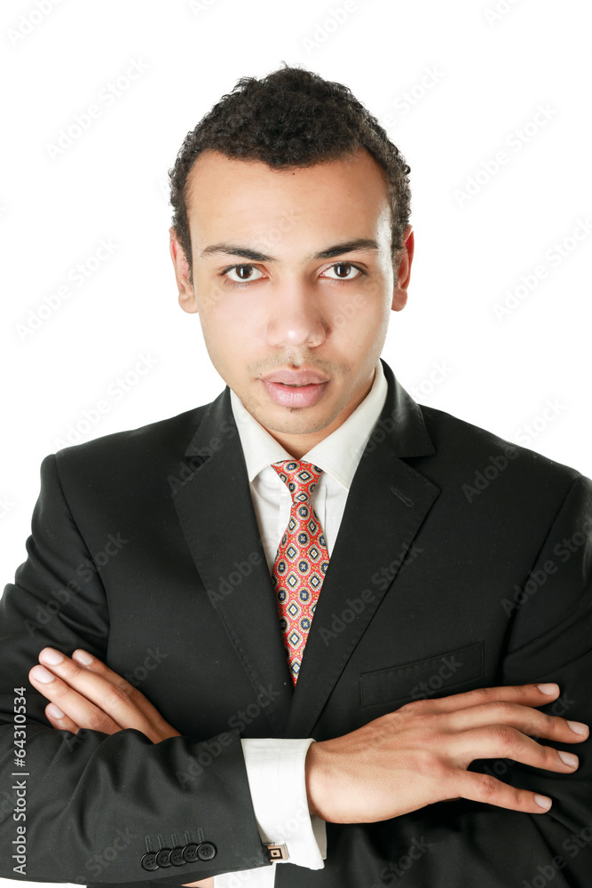 Handsome young business man standing with folded arms Handsome young business man standing with folded arms