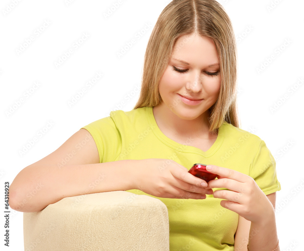 Happy woman sitting on sofa using mobile phone Happy woman sitting on sofa using mobile phone