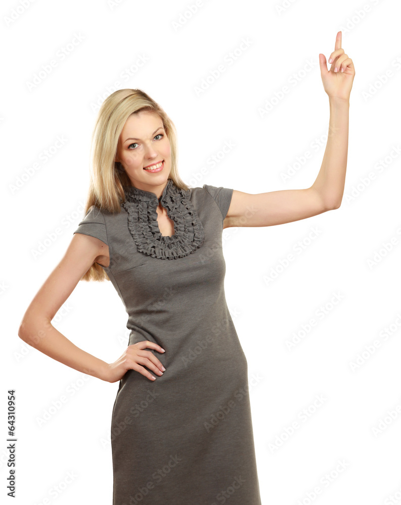 Portrait of a smiling young woman pointing up Portrait of a smiling young woman pointing up