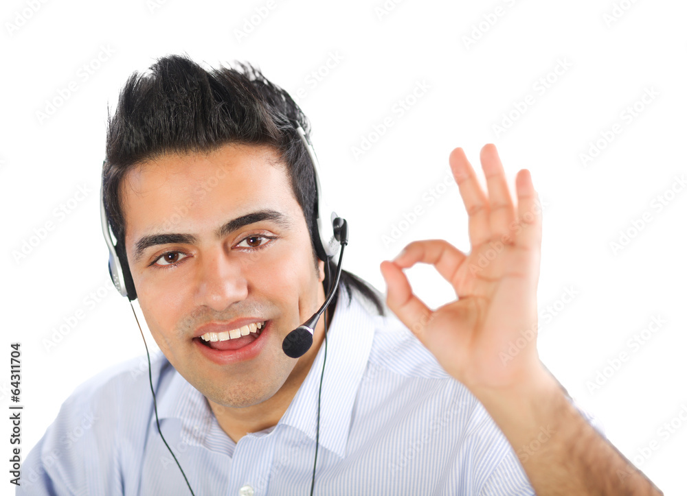 Young man calling with a headset. Isolated on white background. Young man calling with a headset. Isolated on white background.