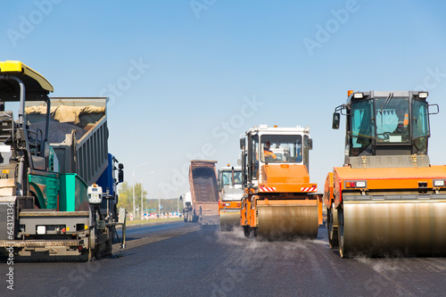 Obraz na płótnie Road rollers, tracked paver and truck during road works