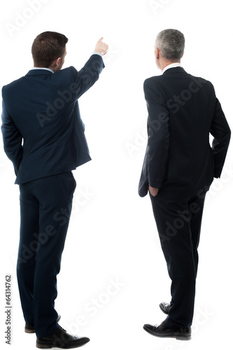 Rear-view image of two businessmen