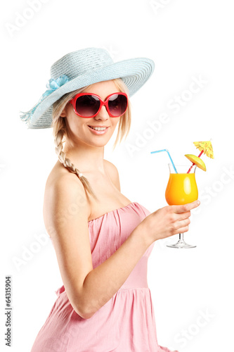 Woman with sunglasses holding an exotic cocktail