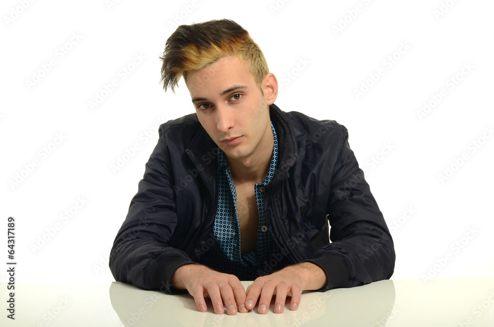 Obraz premium Beautiful brunette man wearing a black jacket with hair on fire