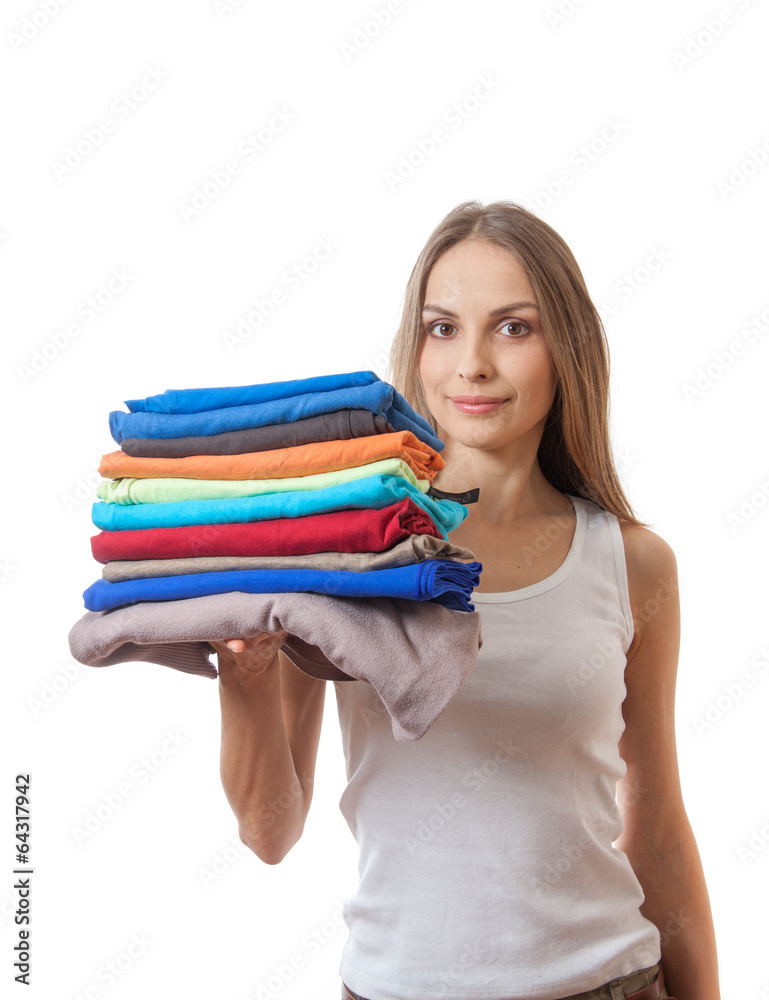 young woman holding a pile of clothes young woman holding a pile of clothes
