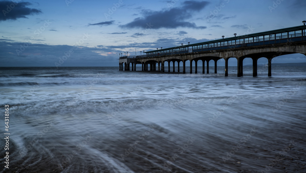 Dawn landscape of pier stretching out into sea Dawn landscape of pier stretching out into sea