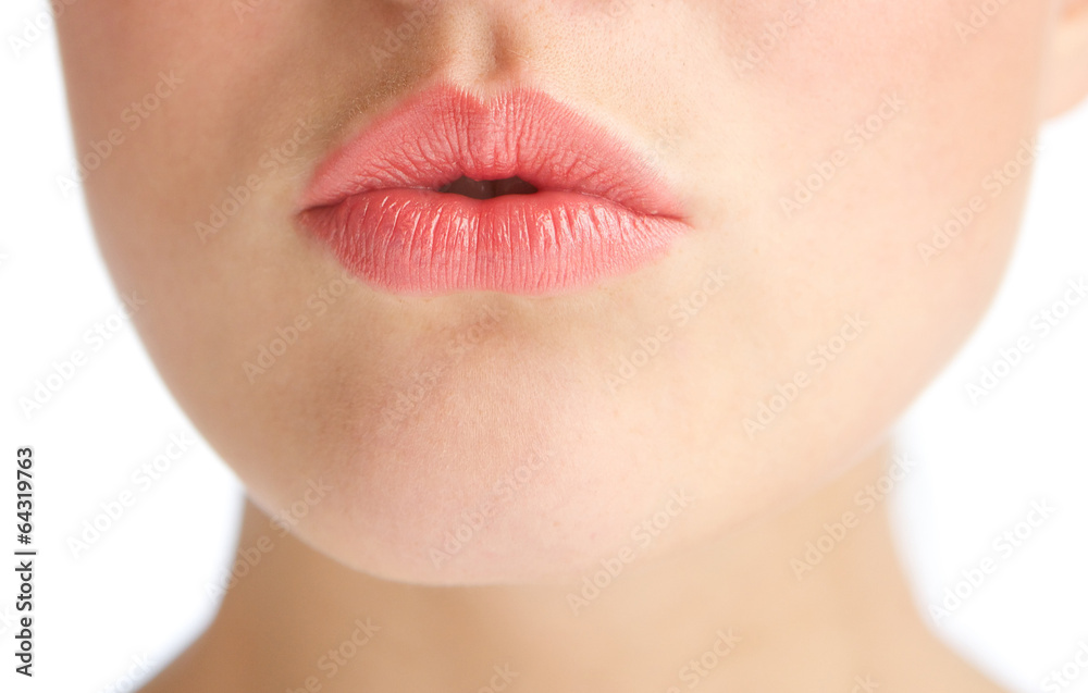 Obraz premium Beautiful young woman with kissing lips