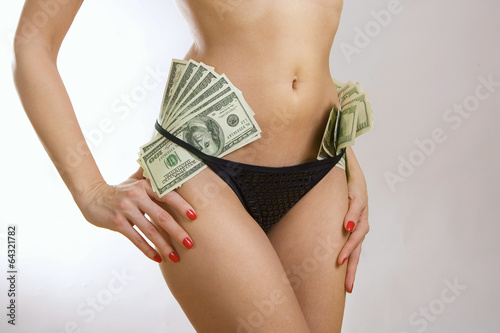 Female perfect sexy body and dollar banknotes money photo