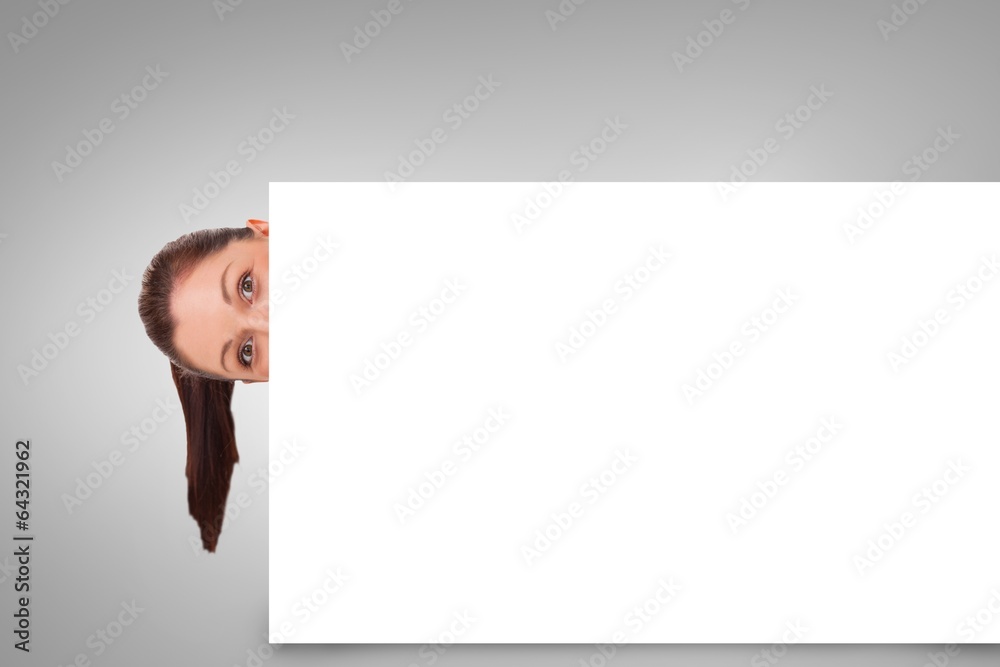 Composite image of pretty brunette showing card Composite image of pretty brunette showing card