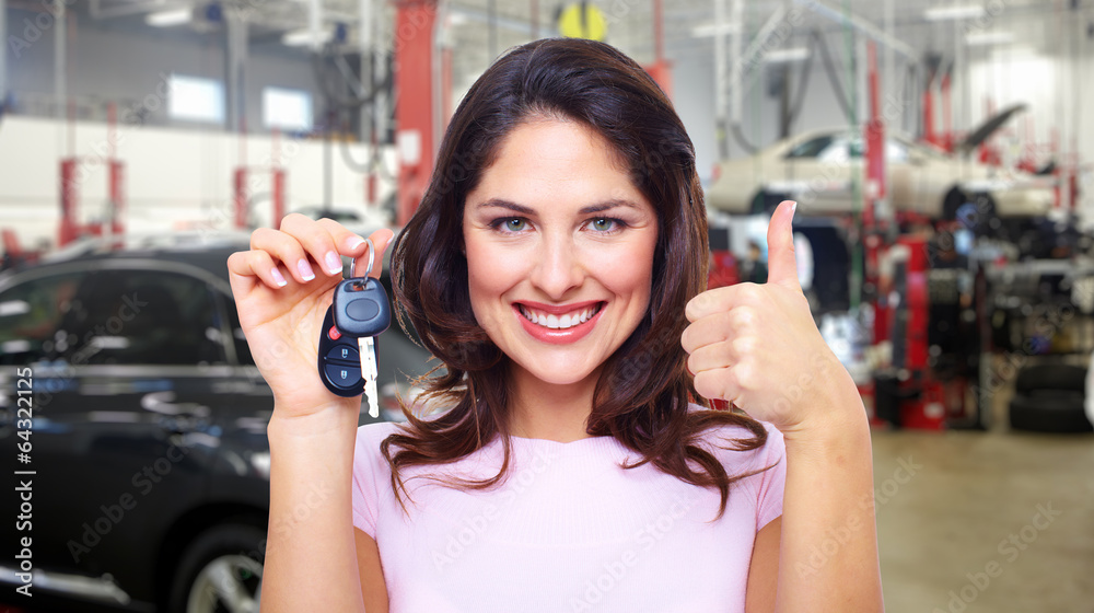 Beautiful woman with a car key.