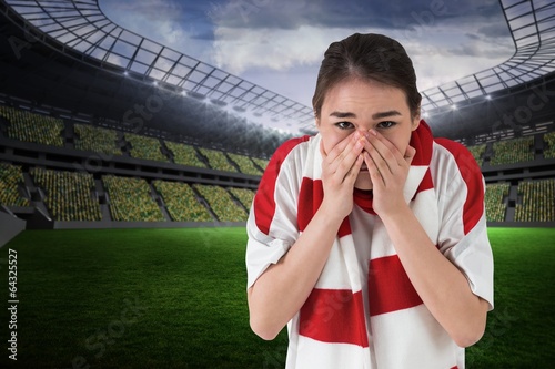 Composite image of nervous football fan looking ahead