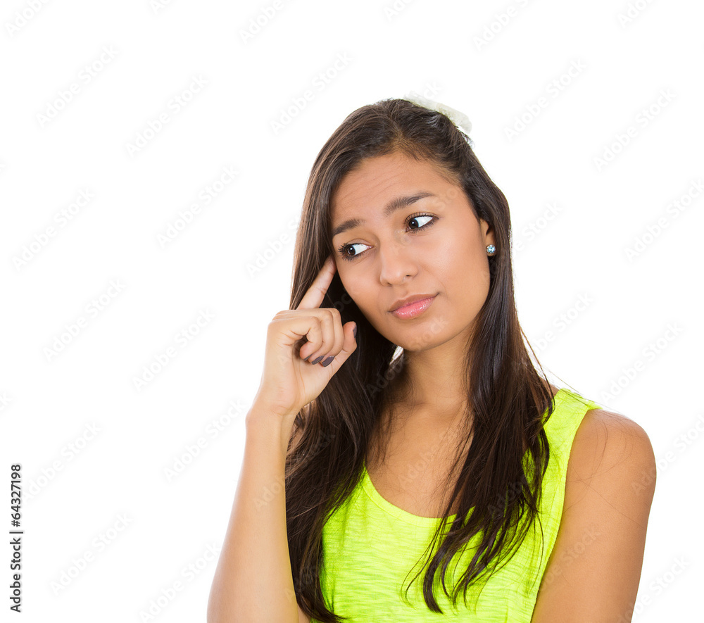 Closeup portrait serious young woman thinking, deciding Closeup portrait serious young woman thinking, deciding