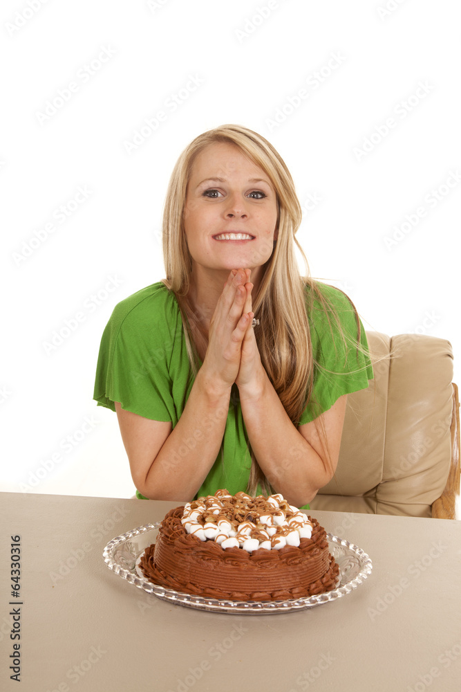 woman green shirt with cake hands together woman green shirt with cake hands together