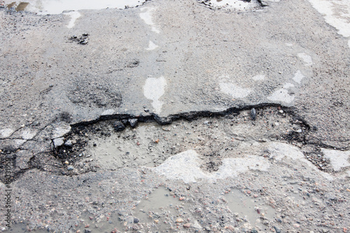 of holes road for cars - a danger on the road