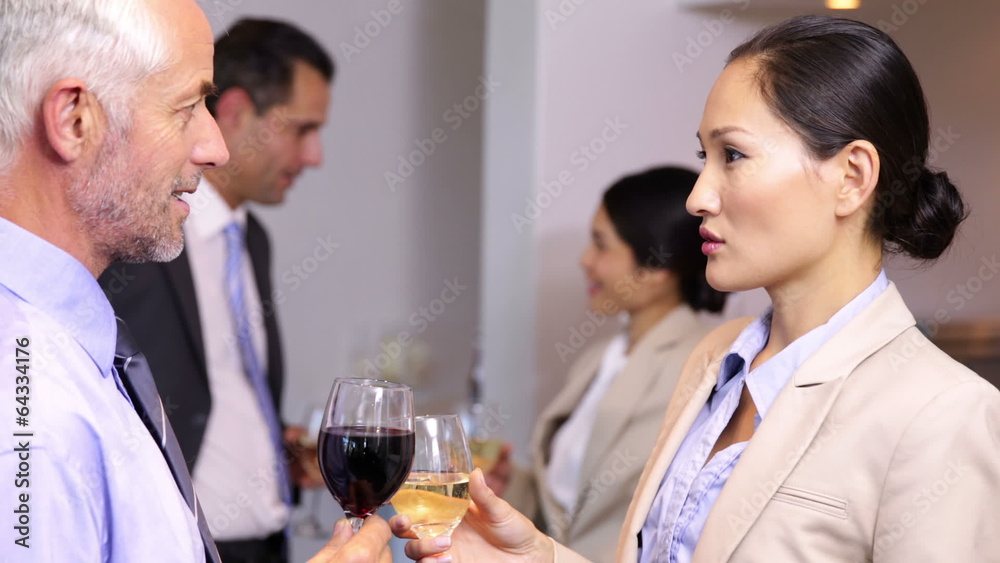 Business team chatting after work and drinking wine Business team chatting after work and drinking wine