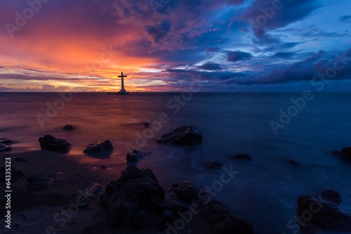 Sea sunset and christian cross photo