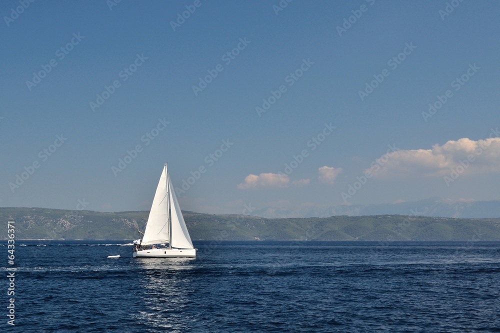 Obraz premium White boat alone on open blue adriatic sea. Croatia