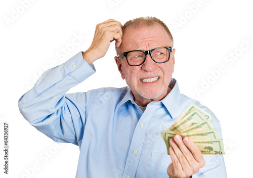 Portrait old man not sure of spending money on white background 