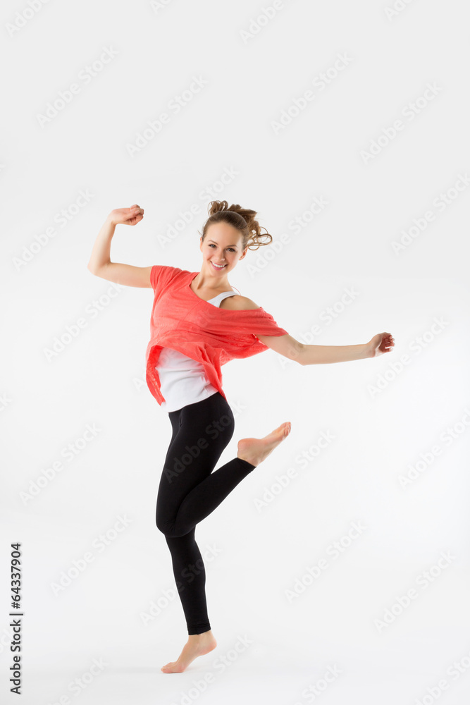 Young casual woman, student jumping. Isolated on grey.