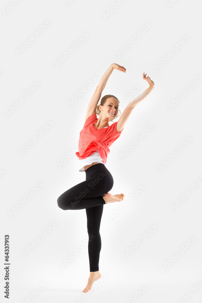 Young Sexy girl moving energetically On grey Background