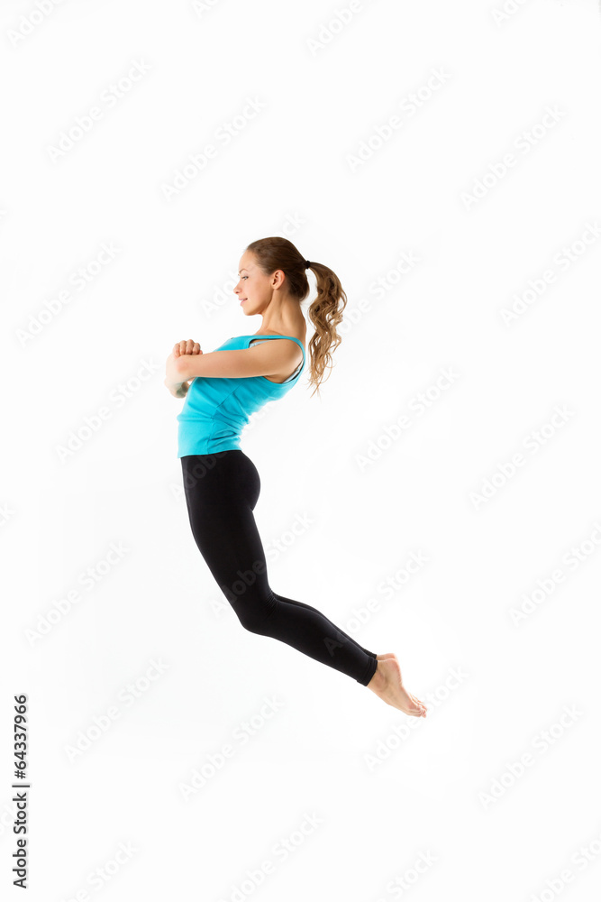 Jumping happy young woman, isolated on white background