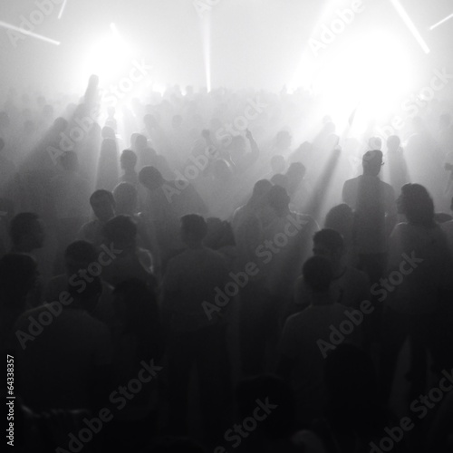 People in front of stage with bright lights