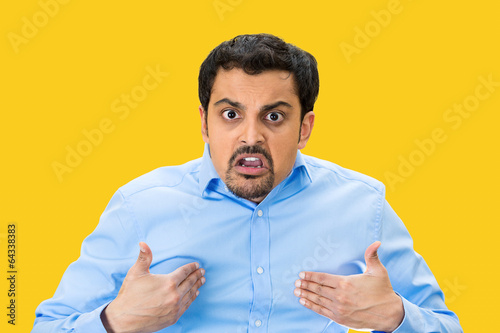 Angry man asking you mean ME? isolated on yellow background