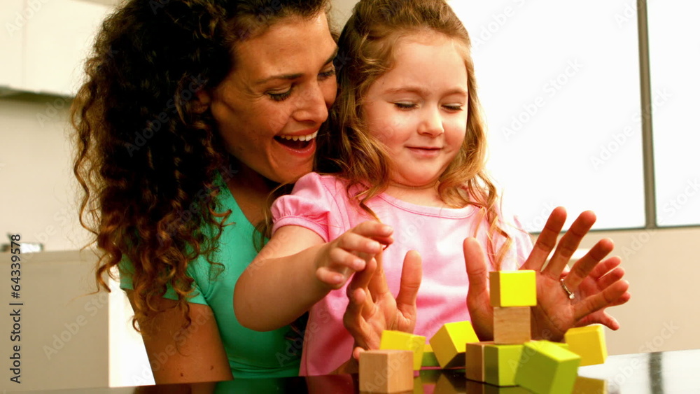 Mother playing with daughter with blocks Mother playing with daughter with blocks