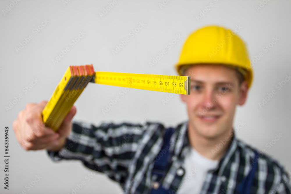 construction worker with a ruler construction worker with a ruler