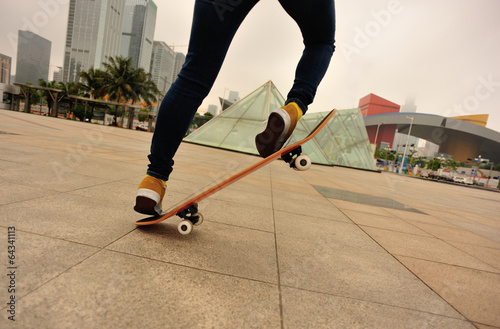 woman skateboarder on street 
