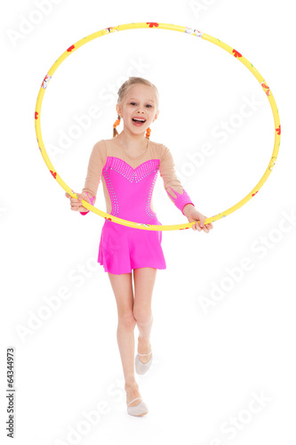 Beautiful little gymnast with the hoop © lotosfoto