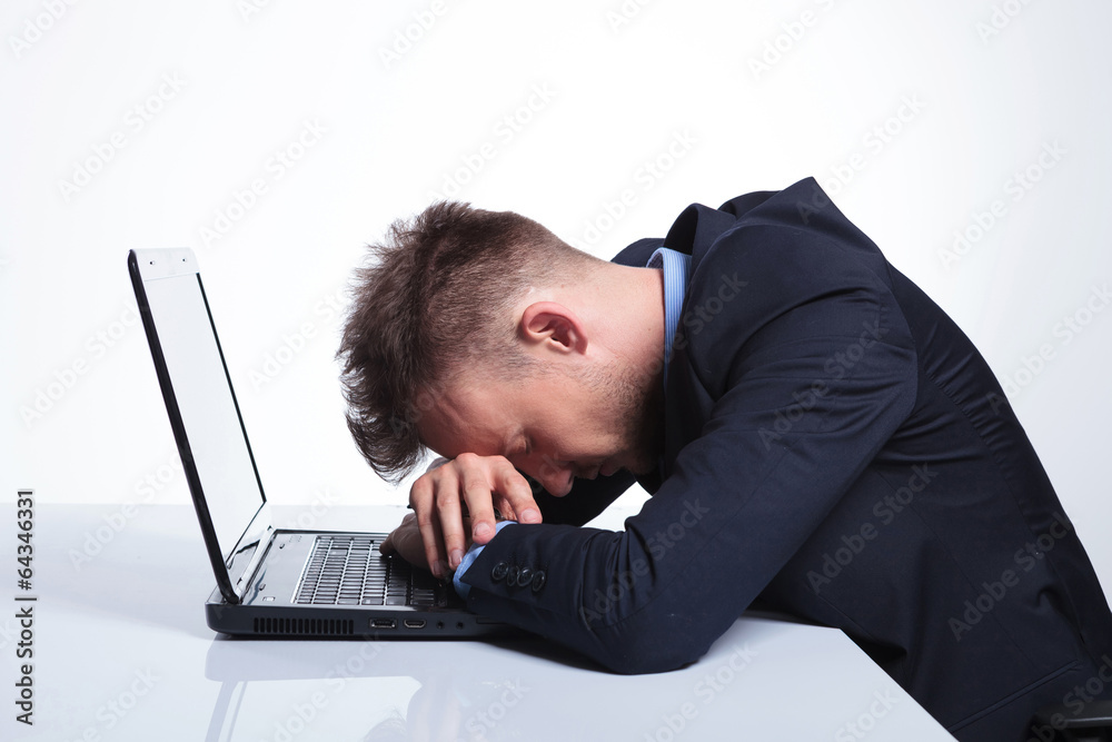 business man takes a nap on laptop business man takes a nap on laptop