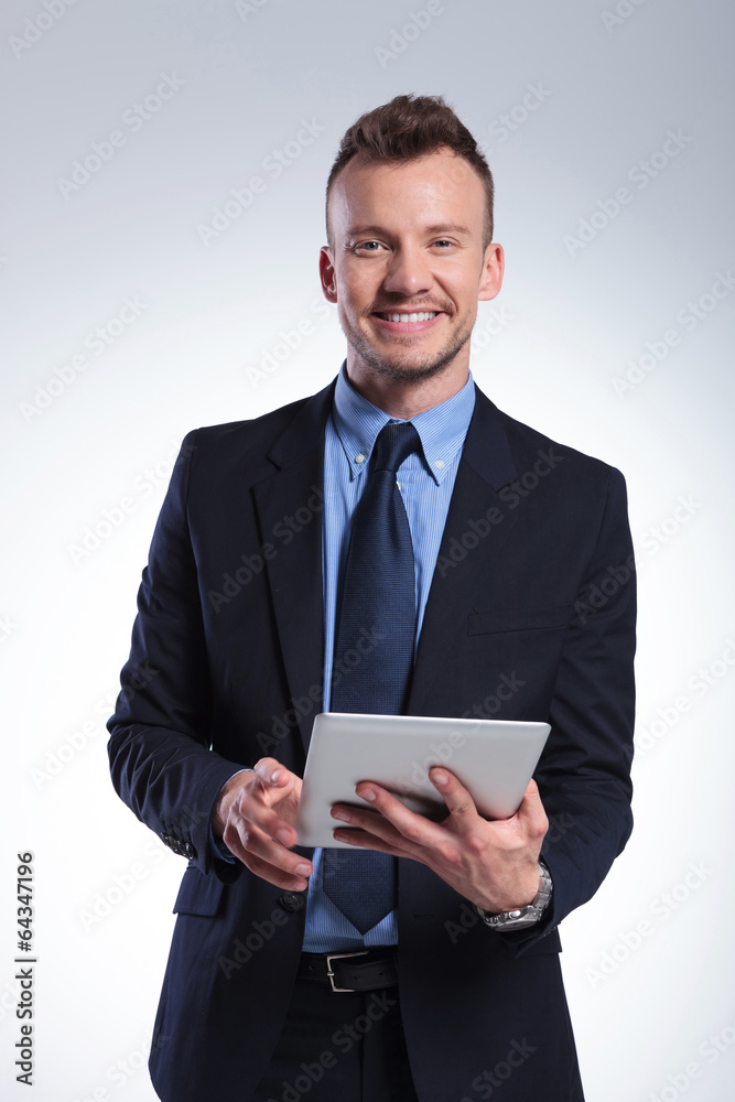 business man with tablet smiles at you business man with tablet smiles at you