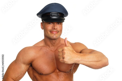 Big muscular man at police showing thumb up