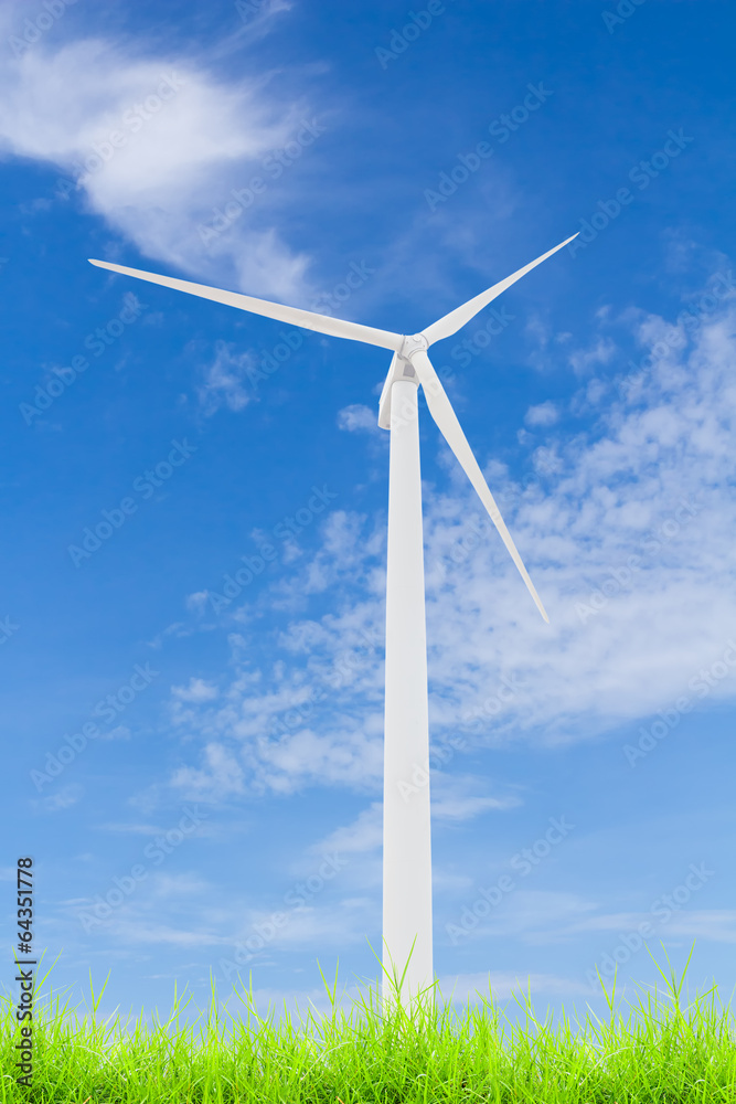wind turbine on green grass with blue sky wind turbine on green grass with blue sky