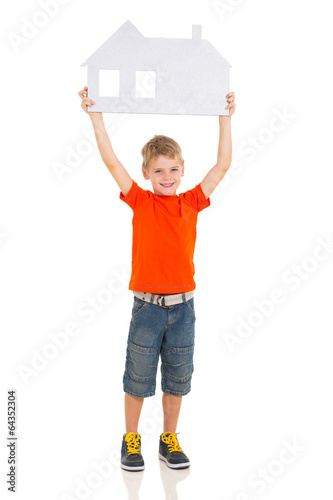 caucasian boy presenting paper house
