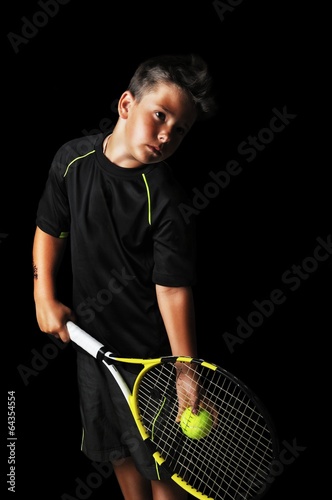 Handsome boy with tennis equipment preparing for serve © cirkoglu