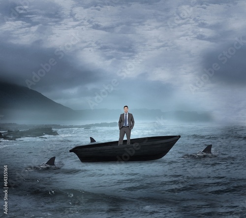 Composite image of thinking businessman in a sailboat
