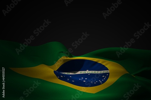 Composite image of brazil flag waving photo