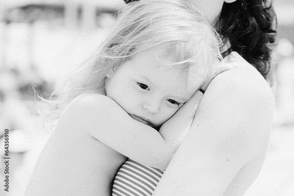 Portrait of mother and her daughter on the beach