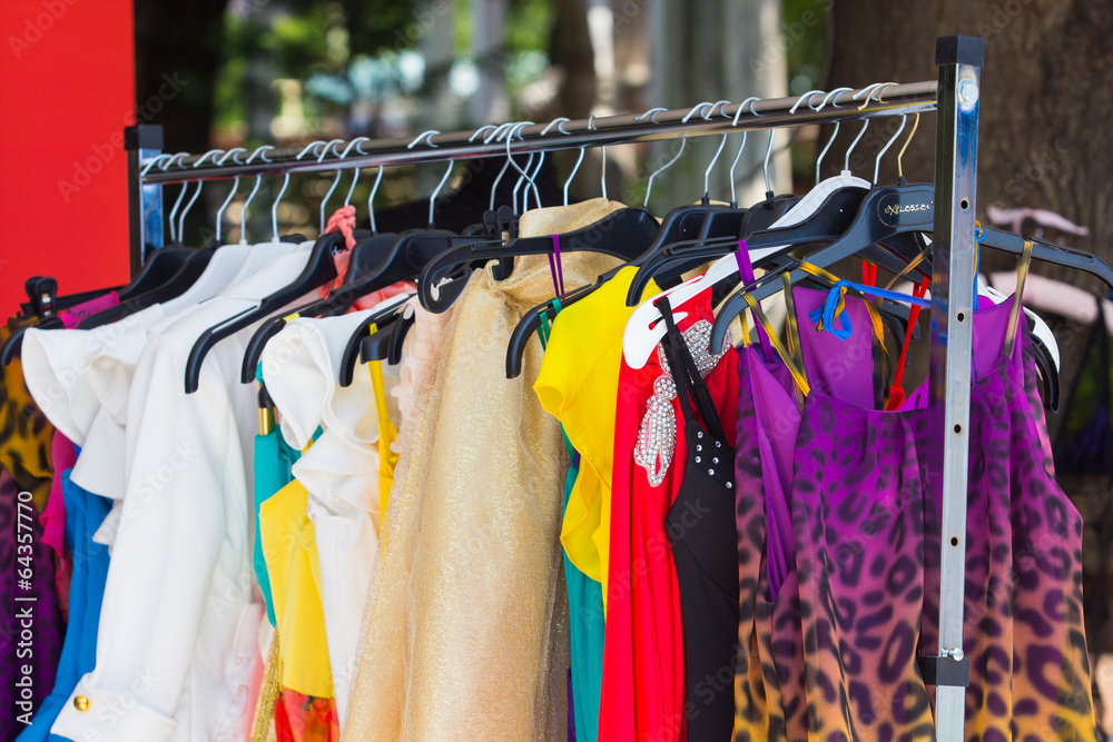 Fototapeta premium fashion clothing on hangers at the show