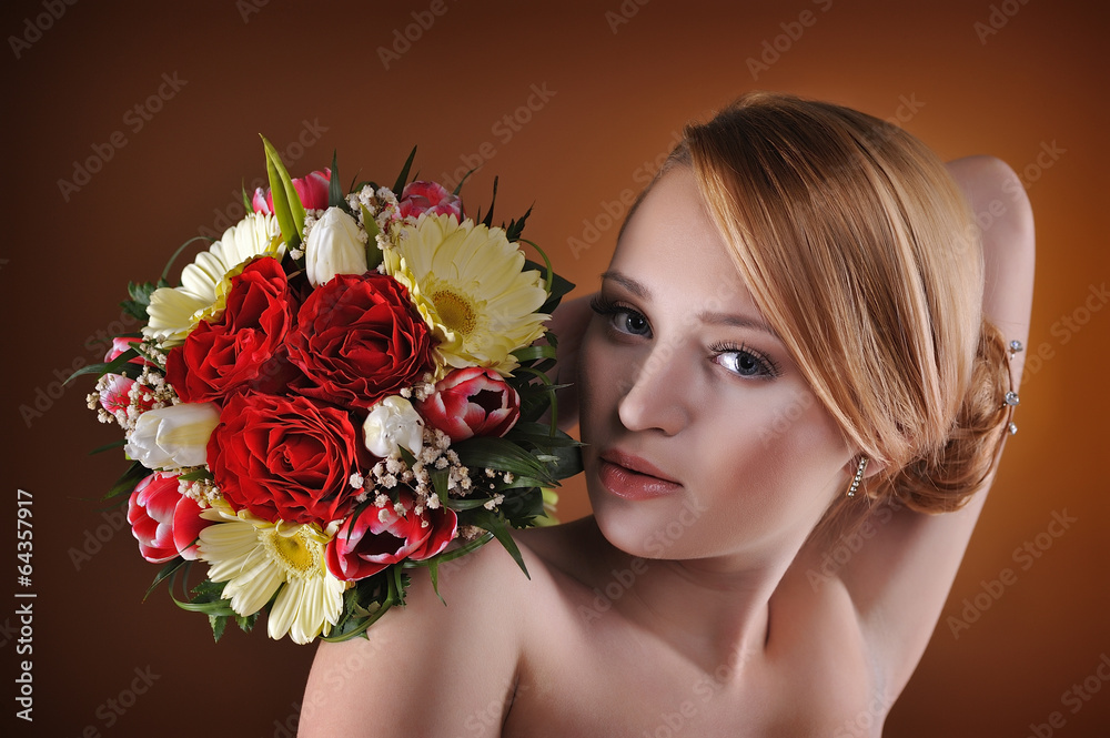 Young and beautiful bride standing with the flower bouquet Young and beautiful bride standing with the flower bouquet