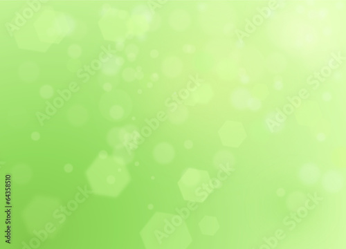 Green spring natural background with bokeh and ray of lights