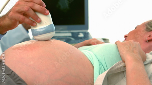 Pregnant blonde getting an ultrasound scan