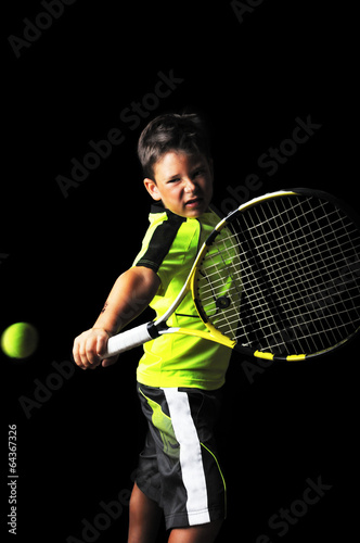 Handsome boy with tennis equipment playing backhand © cirkoglu