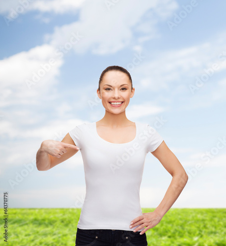 smiling woman in blank white t-shirt © Syda Productions