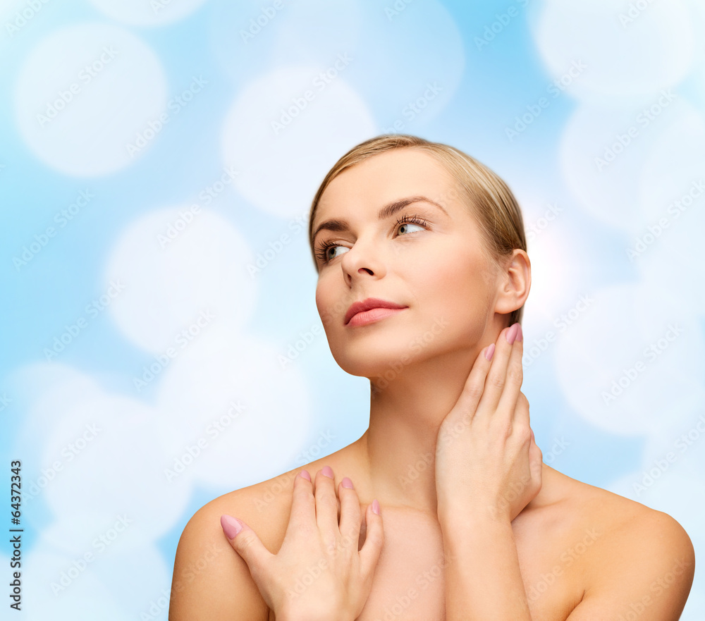 Naklejka premium face and hands of beautiful woman